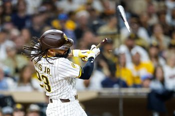 Sep 13, 2025; San Diego, California, USA; San Diego Padres right fielder Fernando Tatis Jr. (23) hits a broken bat single during the sixth inning against the Colorado Rockies at Petco Park. Mandatory Credit: David Frerker-Imagn Images