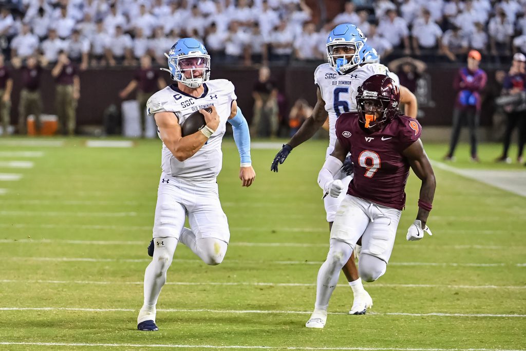 Sep 13, 2025; Blacksburg, Virginia, USA;  Old Dominion Monarchs quarterback Colton Joseph (1) runs the ball as Virginia Tech Hokies cornerback Isaiah Brown-Murray (9) pursues during the third quarter at Lane Stadium. Mandatory Credit: Brian Bishop-Imagn Images