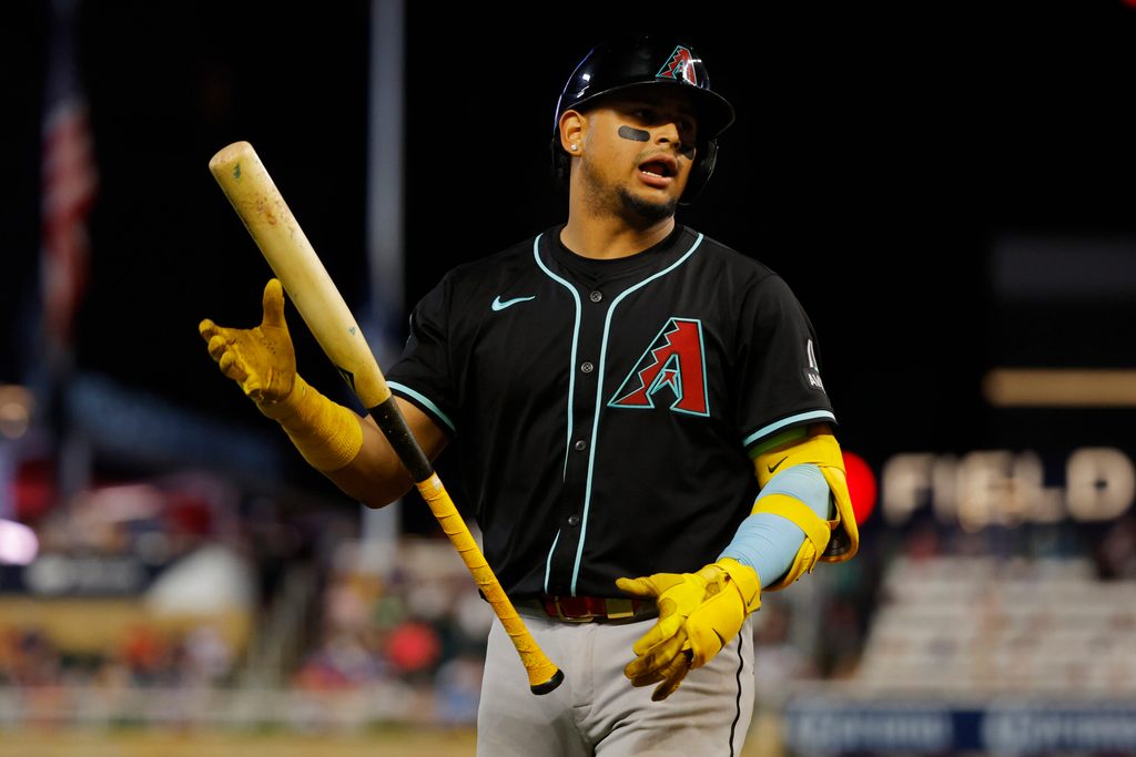 Sep 13, 2025; Minneapolis, Minnesota, USA; Arizona Diamondbacks catcher Gabriel Moreno (14) dislikes the called third strike against him and for the Minnesota Twins in the eighth inning at Target Field. Mandatory Credit: Bruce Kluckhohn-Imagn Images