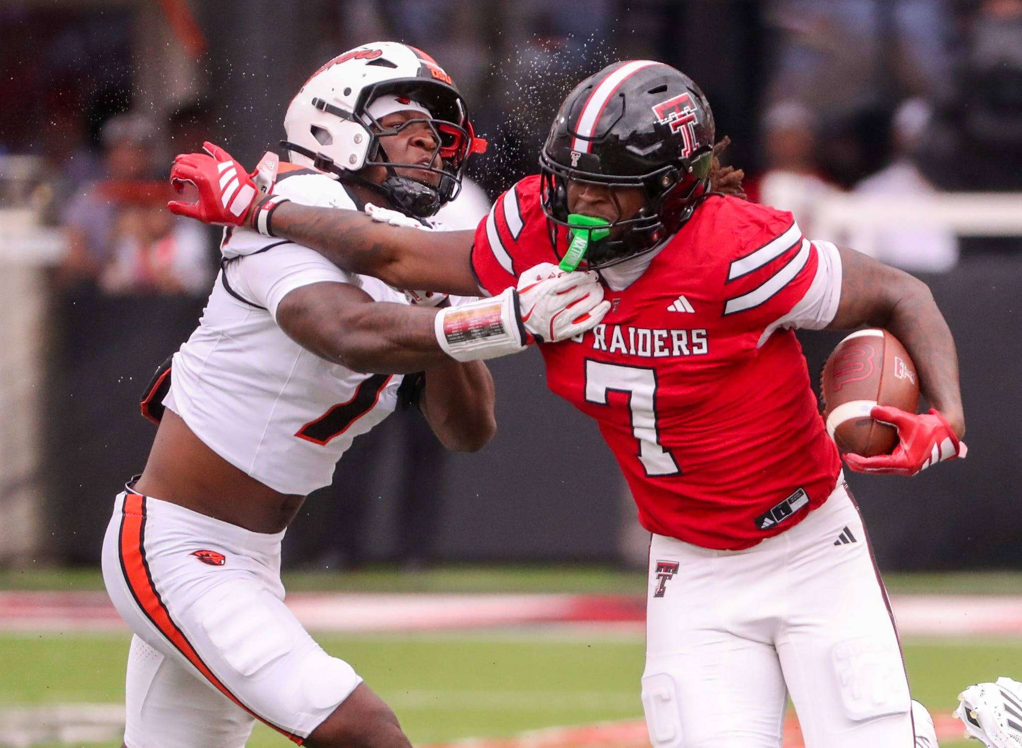 Texas Tech's Terrance Carter Jr. is met by Oregon State's Dexter Foster during a non-conference football game, Saturday, Sept. 13, 2025, at Jones AT&T Stadium.