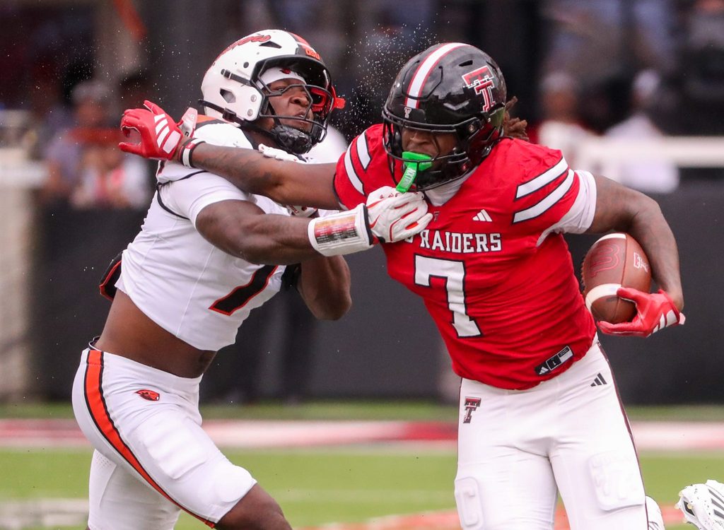 Texas Tech's Terrance Carter Jr. is met by Oregon State's Dexter Foster during a non-conference football game, Saturday, Sept. 13, 2025, at Jones AT&T Stadium.