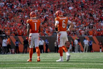 Cincinnati Bengals wide receiver Ja'Marr Chase (1) and Cincinnati Bengals quarterback Jake Browning (6) take a brief break in the final minutes of game time against the Jacksonville Jaguars at Paycor Stadium on Sunday, September 14, 2025. The Bengals move to 2-0 after beating the Jaguars 27-31.