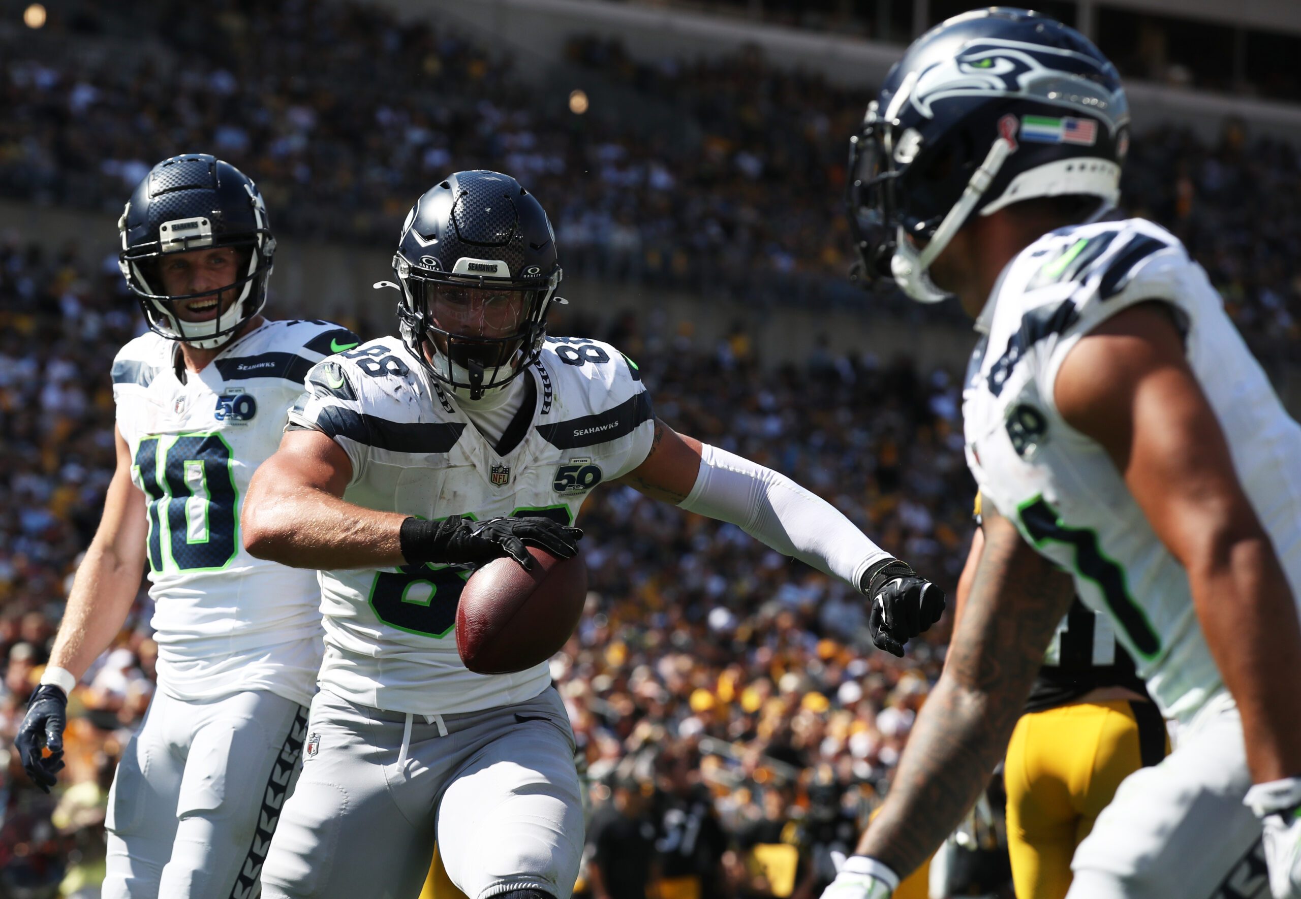 Sep 14, 2025; Pittsburgh, Pennsylvania, USA;  Seattle Seahawks tight end AJ Barner (88) reacts with wide receivers Cooper Kupp (10) and Jaxon Smith-Njigba (right) after catching a touchdown pass against the Pittsburgh Steelers during the third quarter at Acrisure Stadium. Mandatory Credit: Charles LeClaire-Imagn Images