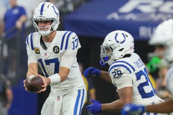 Indianapolis Colts quarterback Daniel Jones (17) hands the ball off to Indianapolis Colts running back Jonathan Taylor (28) on Sunday, Sept. 14, 2025, during a game against the Denver Broncos at Lucas Oil Stadium in Indianapolis.