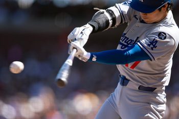 Sep 14, 2025; San Francisco, California, USA; Los Angeles Dodgers designated hitter Shohei Ohtani (17) flies out to left field against the San Francisco Giants during the fifth inning at Oracle Park. Mandatory Credit: D. Ross Cameron-Imagn Images