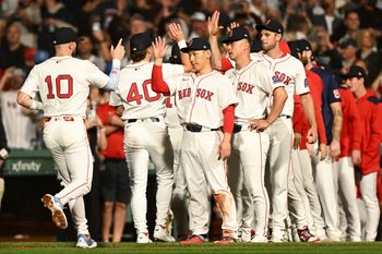 Sep 14, 2025; Boston, Massachusetts, USA; Boston Red Sox shortstop Trevor Story (10) high-fives left fielder Masataka Yoshida (7) after a game against the New York Yankees at Fenway Park. Mandatory Credit: Brian Fluharty-Imagn Images
