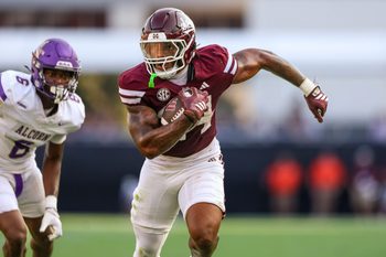 Sep 13, 2025; Starkville, Mississippi, USA; Mississippi State Bulldogs running back Fluff Bothwell (24) runs with the ball against the Alcorn State Braves during the second quarter at Davis Wade Stadium at Scott Field. Mandatory Credit: Wesley Hale-Imagn Images