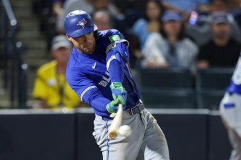 Sep 15, 2025; Tampa, Florida, USA; Toronto Blue Jays outfielder George Springer (21) hits an rbi single against the Tampa Bay Rays in the eleventh inning at George M. Steinbrenner Field. Mandatory Credit: Nathan Ray Seebeck-Imagn Images