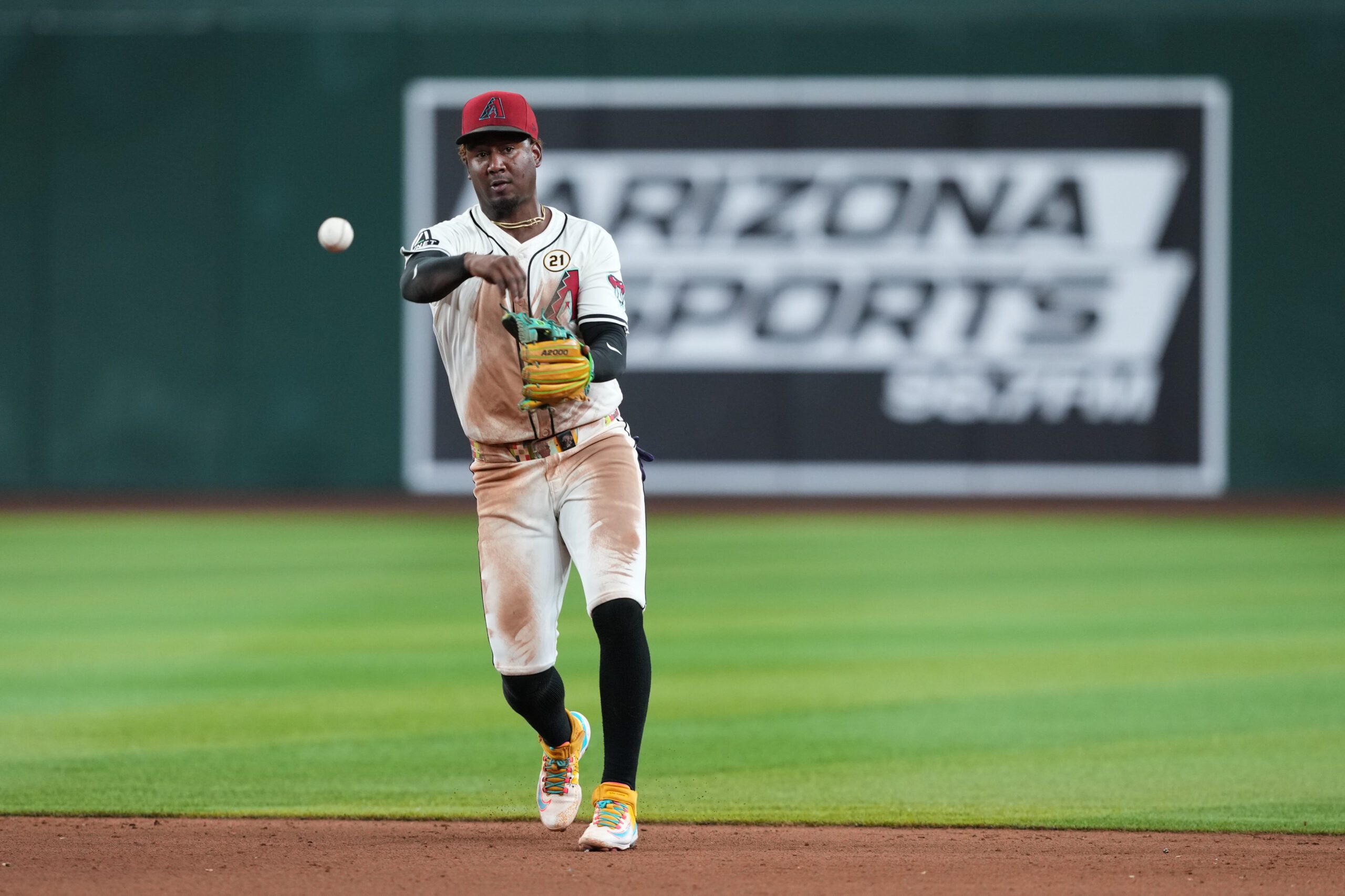 Sep 15, 2025; Phoenix, Arizona, USA; Arizona Diamondbacks shortstop Geraldo Perdomo (2) throws to first against the San Francisco Giants during the ninth inning at Chase Field. Mandatory Credit: Joe Camporeale-Imagn Images