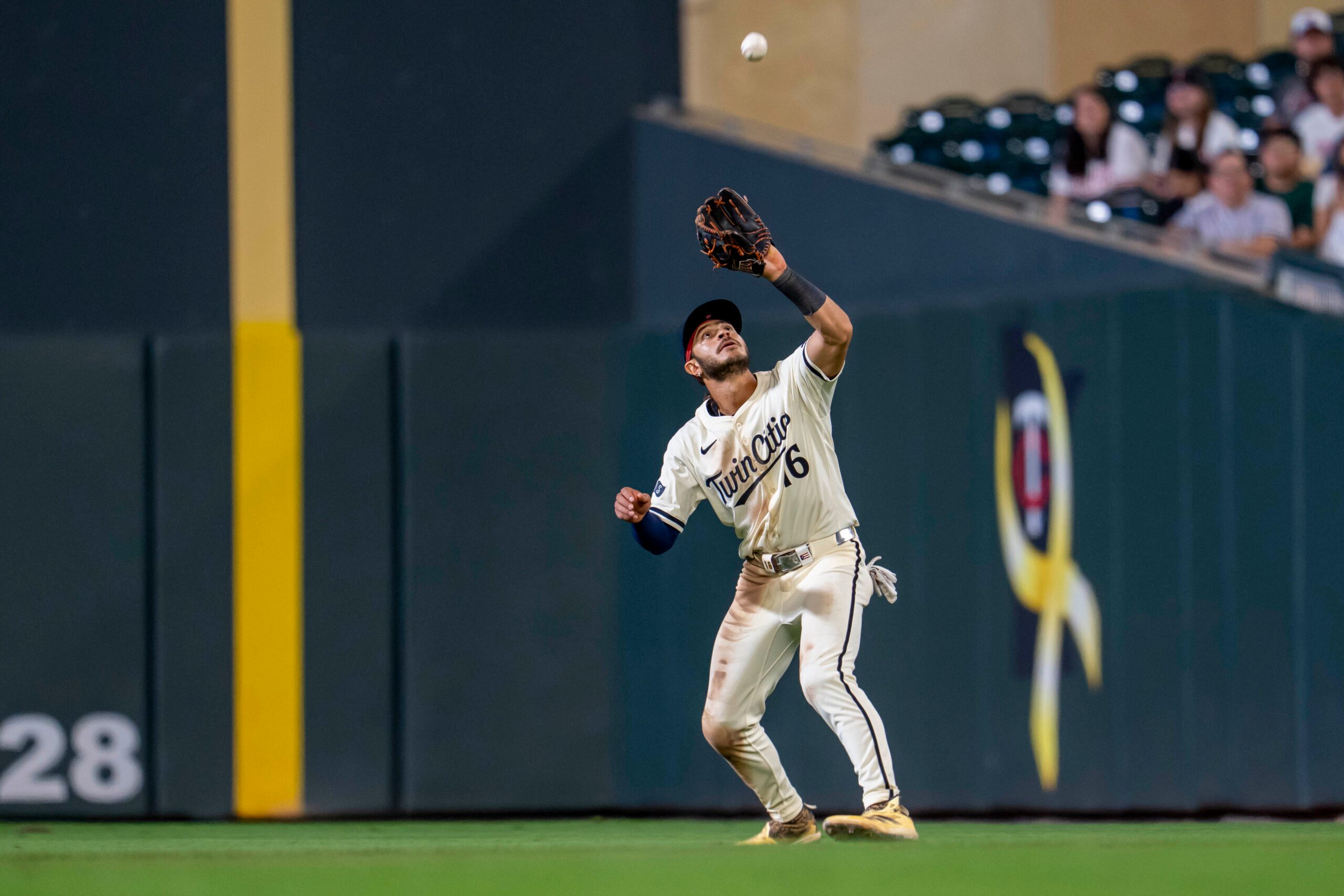 Sep 16, 2025; Minneapolis, Minnesota, USA; Minnesota Twins second baseman Austin Martin (16) catches a fly ball against the New York Yankees in the ninth inning at Target Field. Mandatory Credit: Jesse Johnson-Imagn Images