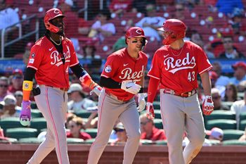 Sep 17, 2025; St. Louis, Missouri, USA; Cincinnati Reds shortstop Elly De La Cruz (44, left), Cincinnati Reds first baseman Spencer Steer (7, center), and Cincinnati Reds third baseman Sal Stewart (43) walk back to the dugout after Steer hit a three-rin home run in the fourth inning against the St. Louis Cardinals at Busch Stadium. Mandatory Credit: Tim Vizer-Imagn Images