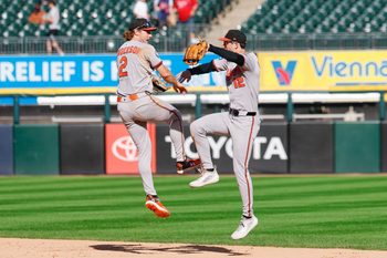 Sep 17, 2025; Chicago, Illinois, USA; Baltimore Orioles shortstop Gunnar Henderson (2) and left fielder Dylan Beavers (12) celebrate team's win against the Chicago White Sox in a baseball game at Rate Field. Mandatory Credit: Kamil Krzaczynski-Imagn Images