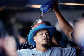 Sep 18, 2025; Denver, Colorado, USA; Miami Marlins designated hitter Heriberto Hernandez (64) celebrates in the dugout on a two run home run in the ninth inning against the Colorado Rockies at Coors Field. Mandatory Credit: Isaiah J. Downing-Imagn Images