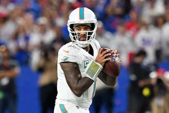 Sep 18, 2025; Orchard Park, New York, USA; Miami Dolphins quarterback Tua Tagovailoa (1) looks to pass in the first half against the Buffalo Bills at Highmark Stadium. Mandatory Credit: Mark Konezny-Imagn Images