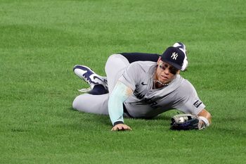 Sep 19, 2025; Baltimore, Maryland, USA; New York Yankees outfielder Aaron Judge (99) makes a diving catch during the third inning against the Baltimore Orioles at Oriole Park at Camden Yards. Mandatory Credit: Daniel Kucin Jr.-Imagn Images