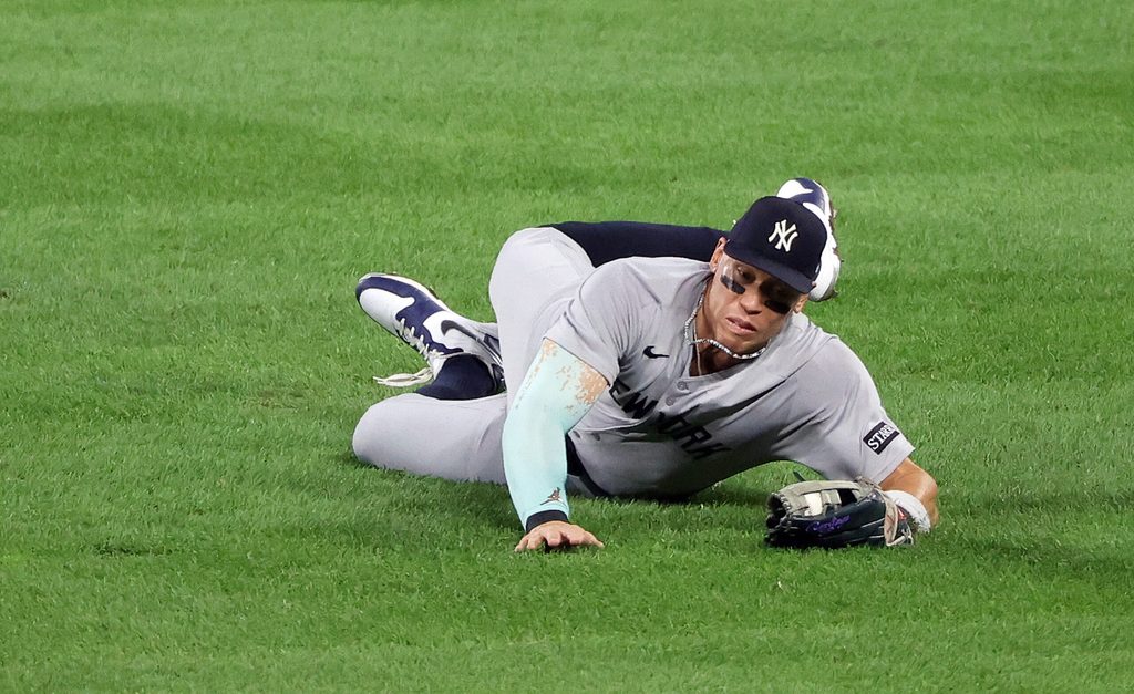 Sep 19, 2025; Baltimore, Maryland, USA; New York Yankees outfielder Aaron Judge (99) makes a diving catch during the third inning against the Baltimore Orioles at Oriole Park at Camden Yards. Mandatory Credit: Daniel Kucin Jr.-Imagn Images