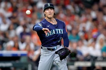 Sep 19, 2025; Houston, Texas, USA; Seattle Mariners pitcher Bryan Woo (22) throws a fielded ball to first base for an out against the Houston Astros during the second inning at Daikin Park. Mandatory Credit: Erik Williams-Imagn Images