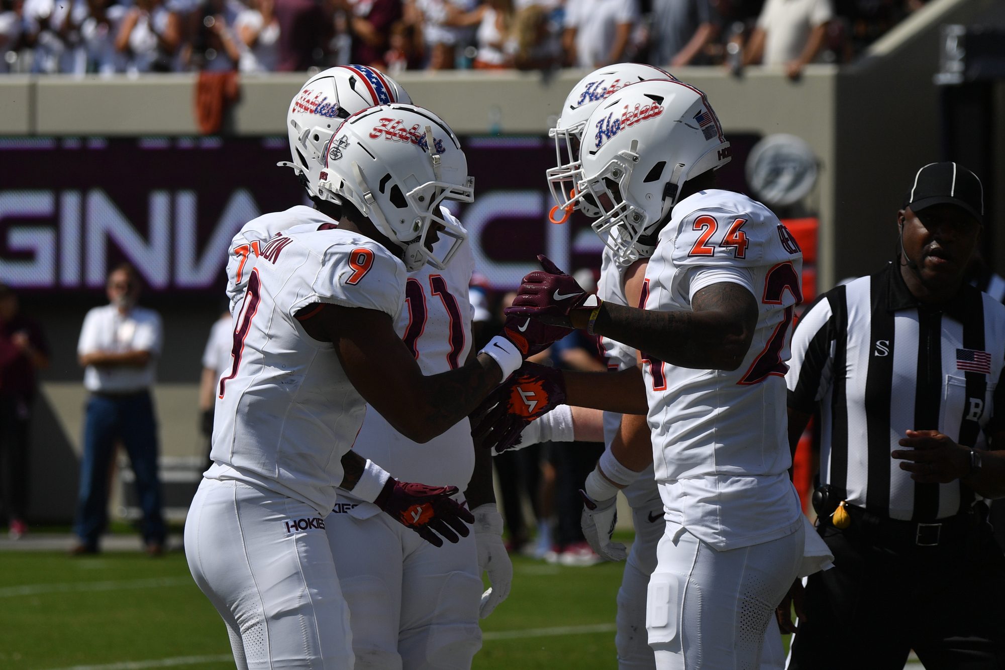 Sep 20, 2025; Blacksburg, Virginia, USA;  Virginia Tech Hokies wide receiver Cameron Seldon (9) celebrates with running back Braydon Bennett (24) after a touchdown run during the first quarter against the Wofford Terriers  at Lane Stadium. Mandatory Credit: Brian Bishop-Imagn Images