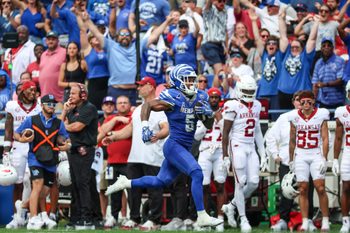 Sep 20, 2025; Memphis, Tennessee, USA; Memphis Tigers running back Sutton Smith (5) runs for a touchdown against the Arkansas Razorbacks during the second half at Simmons Bank Liberty Stadium. Mandatory Credit: Wesley Hale-Imagn Images