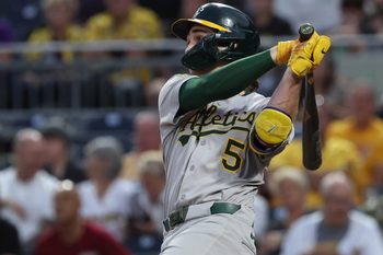 Sep 20, 2025; Pittsburgh, Pennsylvania, USA;  Athletics shortstop Jacob Wilson (5) hits a double against the Pittsburgh Pirates during the second inning at PNC Park. Mandatory Credit: Charles LeClaire-Imagn Images