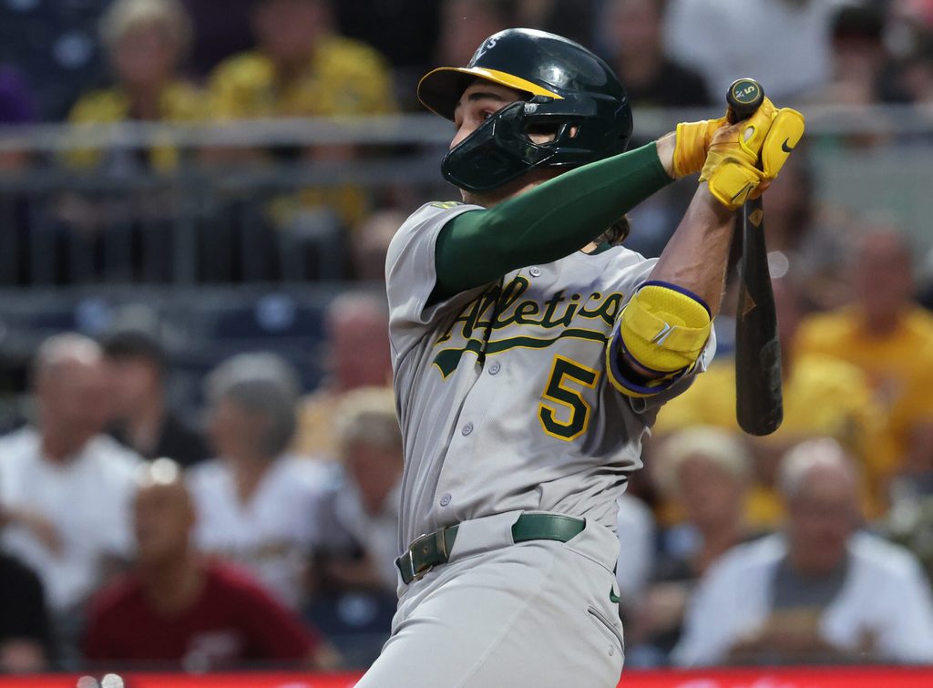 Sep 20, 2025; Pittsburgh, Pennsylvania, USA; Athletics shortstop Jacob Wilson (5) hits a double against the Pittsburgh Pirates during the second inning at PNC Park. Mandatory Credit: Charles LeClaire-Imagn Images