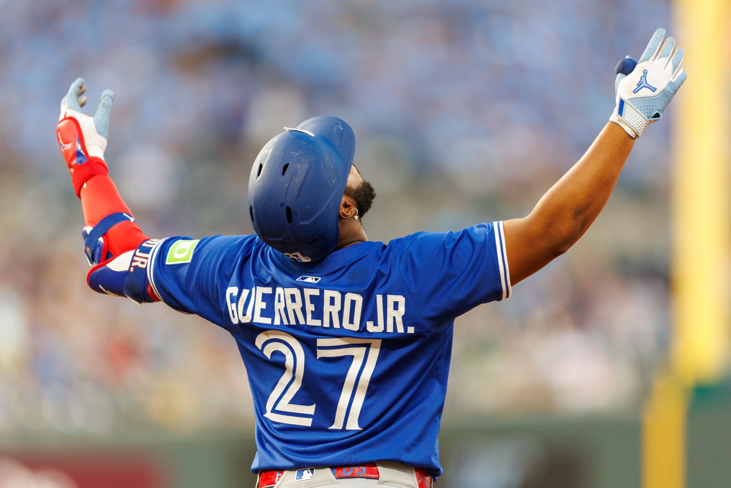 Sep 20, 2025; Kansas City, Missouri, USA; Toronto Blue Jays first base Vladimir Guerrero Jr. (27) reacts to a play during the fourth inning against the Kansas City Royals at Kauffman Stadium. Mandatory Credit: William Purnell-Imagn Images
