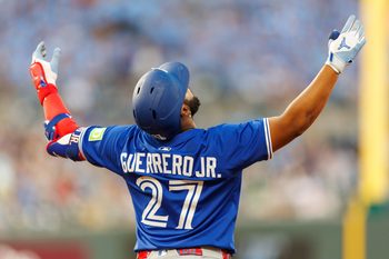 Sep 20, 2025; Kansas City, Missouri, USA; Toronto Blue Jays first base Vladimir Guerrero Jr. (27) reacts to a play during the fourth inning against the Kansas City Royals at Kauffman Stadium. Mandatory Credit: William Purnell-Imagn Images