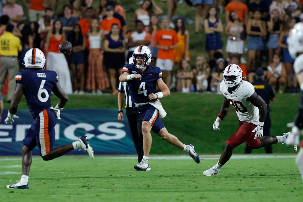 Sep 20, 2025; Charlottesville, Virginia, USA; Virginia Cavaliers quarterback Chandler Morris (4) passes the ball to Cavaliers wide receiver Cam Ross (6) as Stanford Cardinal linebacker Ese Dubre (30) chases during the second quarter at Scott Stadium. Mandatory Credit: Geoff Burke-Imagn Images