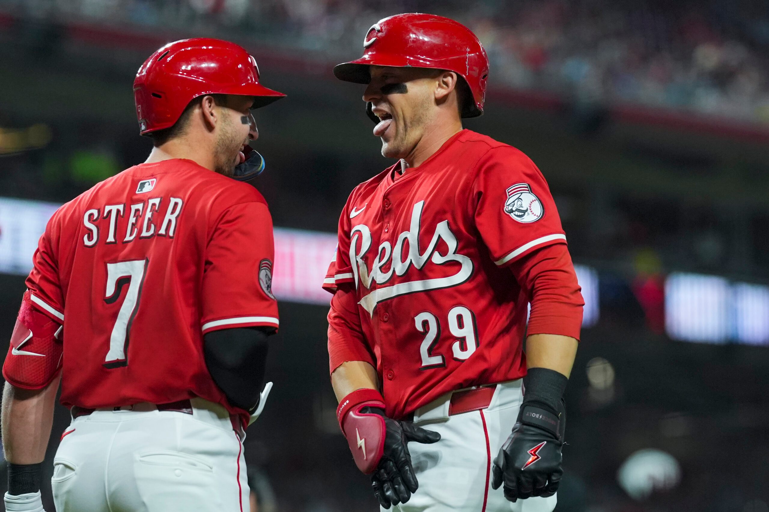Sep 20, 2025; Cincinnati, Ohio, USA; Cincinnati Reds outfielder TJ Friedl (29) celebrates with first baseman Spencer Steer (7) after hitting a solo home run against the Chicago Cubs in the seventh inning at Great American Ball Park. Mandatory Credit: Aaron Doster-Imagn Images