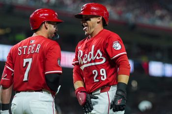 Sep 20, 2025; Cincinnati, Ohio, USA; Cincinnati Reds outfielder TJ Friedl (29) celebrates with first baseman Spencer Steer (7) after hitting a solo home run against the Chicago Cubs in the seventh inning at Great American Ball Park. Mandatory Credit: Aaron Doster-Imagn Images