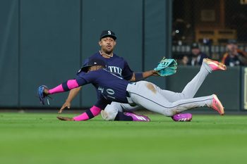 Sep 20, 2025; Houston, Texas, USA; Seattle Mariners right fielder Victor Robles (10) makes a diving catch during the ninth inning against the Houston Astros at Daikin Park. Mandatory Credit: Troy Taormina-Imagn Images