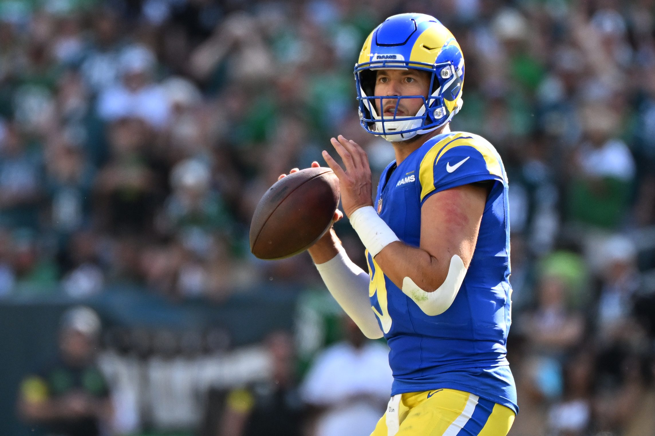 Sep 21, 2025; Philadelphia, Pennsylvania, USA; Los Angeles Rams quarterback Matthew Stafford (9) looks for a receiver during the fourth quarter against the Philadelphia Eagles at Lincoln Financial Field. Mandatory Credit: Eric Hartline-Imagn Images