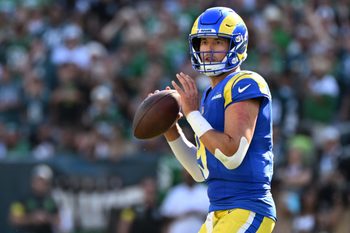 Sep 21, 2025; Philadelphia, Pennsylvania, USA; Los Angeles Rams quarterback Matthew Stafford (9) looks for a receiver during the fourth quarter against the Philadelphia Eagles at Lincoln Financial Field. Mandatory Credit: Eric Hartline-Imagn Images