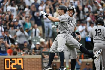 Sep 21, 2025; Baltimore, Maryland, USA;  New York Yankees first base Ben Rice (22) celebrates with designated hitter Aaron Judge (99) at home plate after hitting a tenth inning grand slam against the Baltimore Orioles at Oriole Park at Camden Yards. Mandatory Credit: Tommy Gilligan-Imagn Images