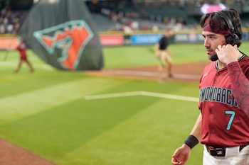 Sep 21, 2025; Phoenix, Arizona, USA; Arizona Diamondbacks outfielder Corbin Carroll (7) is interviewed after becoming the first Arizona Diamondbacks to join the 30-30 club after a game against the Philadelphia Phillies at Chase Field. Mandatory Credit: Allan Henry-Imagn Images