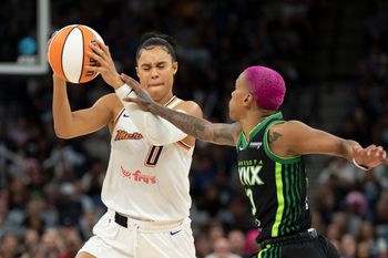 2Sep 23, 2025; Minneapolis, Minnesota, USA; Phoenix Mercury forward Satou Sabally (0) drives against Minnesota Lynx guard Courtney Williams (10) in the second half during game two of the second round for the 2025 WNBA Playoffs at Target Center. Mandatory Credit: Jesse Johnson-Imagn Images