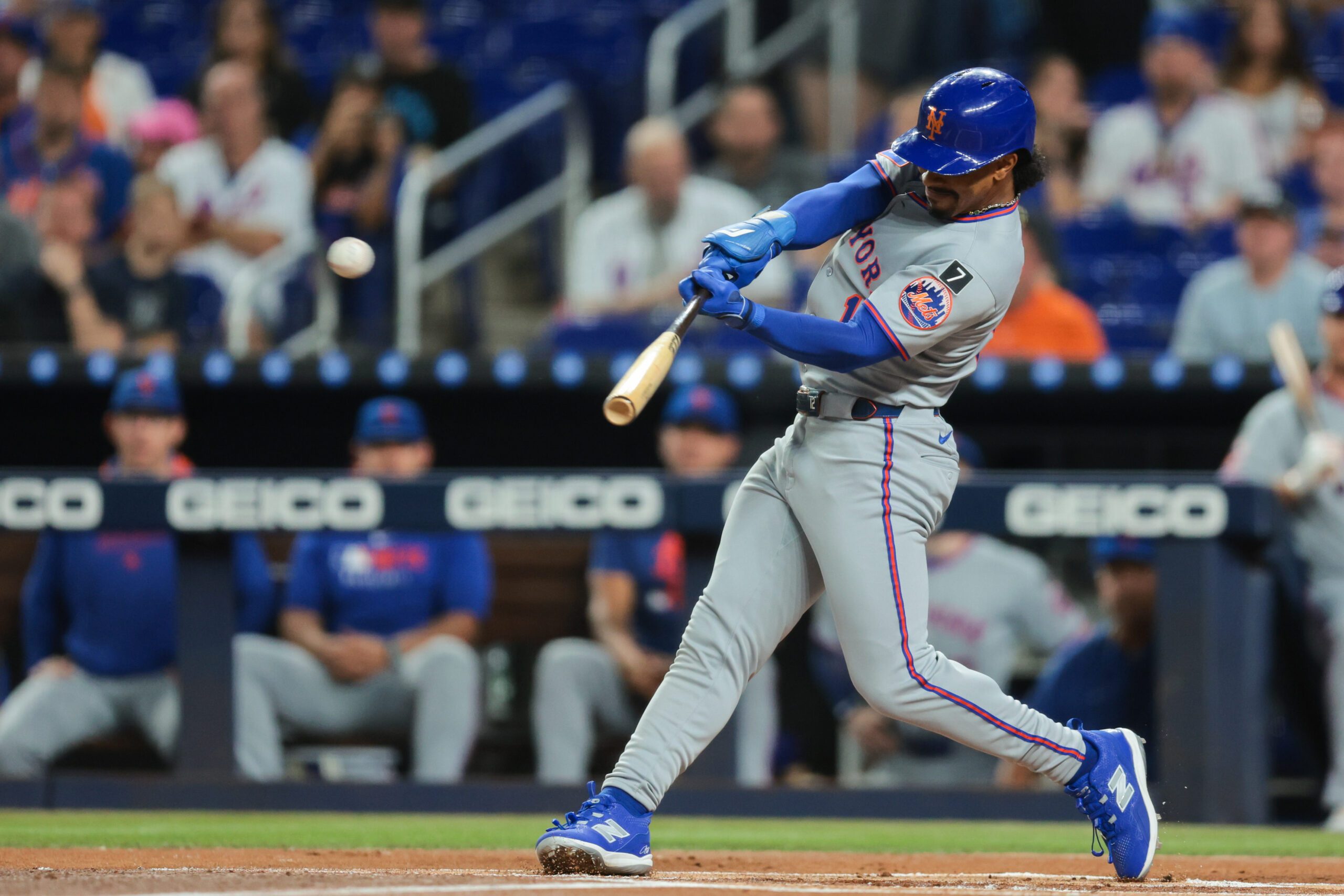 Sep 26, 2025; Miami, Florida, USA; New York Mets shortstop Francisco Lindor (12) hits a home run against the Miami Marlins during the first inning at loanDepot Park. Mandatory Credit: Sam Navarro-Imagn Images