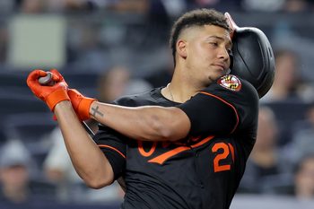 Sep 26, 2025; Bronx, New York, USA; Baltimore Orioles designated hitter Samuel Basallo (29) loses his helmet while swinging at a pitch during the sixth inning against the New York Yankees at Yankee Stadium. Mandatory Credit: Brad Penner-Imagn Images