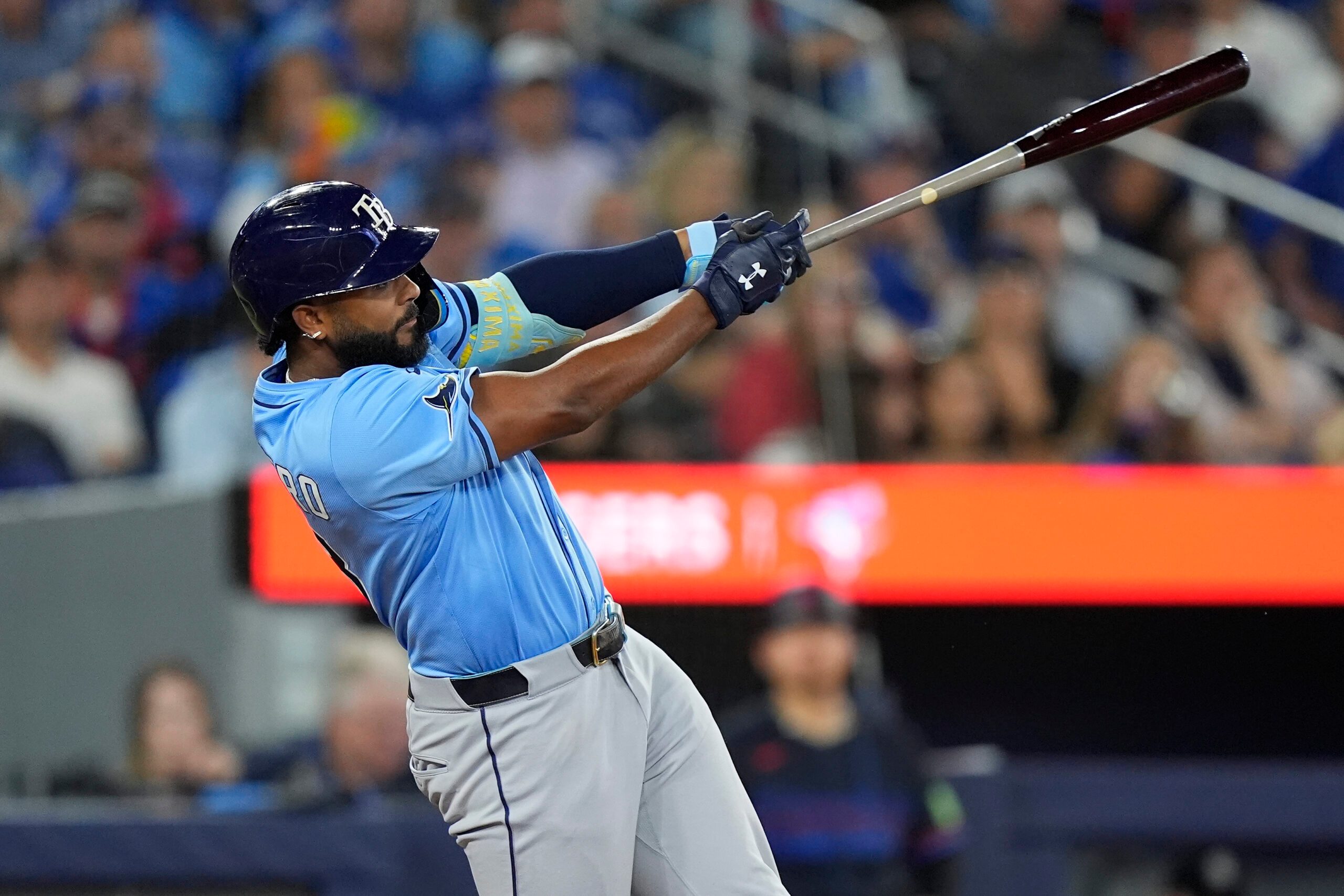 Sep 26, 2025; Toronto, Ontario, CAN; Tampa Bay Rays third baseman Junior Caminero (13) hits a single against the Toronto Blue Jays  during the eighth inning at Rogers Centre. Mandatory Credit: John E. Sokolowski-Imagn Images