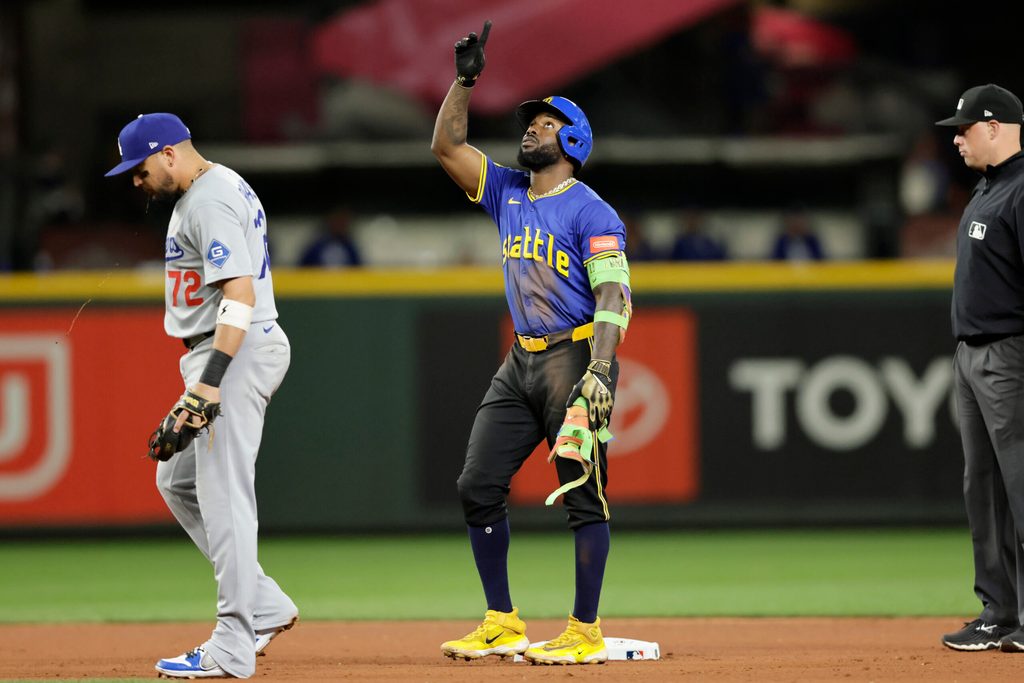 Sep 26, 2025; Seattle, Washington, USA; Seattle Mariners left fielder Randy Arozarena (56) points reaching second on a double against the Los Angeles Dodgers during the seventh inning at T-Mobile Park. Mandatory Credit: John Froschauer-Imagn Images