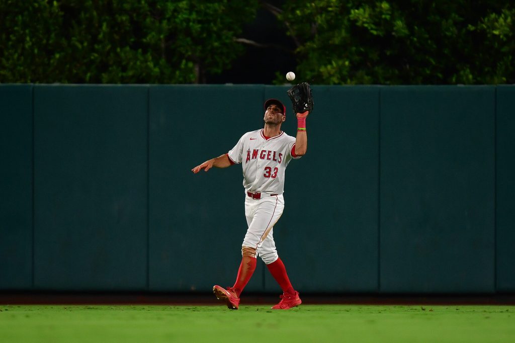 Sep 26, 2025; Anaheim, California, USA; Los Angeles Angels outfielder Chris Taylor (33) catches the fly ball of Houston Astros pinch hitter Victor Caratini (17) during the eighth inning at Angel Stadium. Mandatory Credit: Gary A. Vasquez-Imagn Images