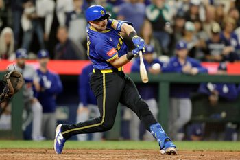 Sep 26, 2025; Seattle, Washington, USA; Seattle Mariners catcher Cal Raleigh (29) hits a double against the Los Angeles Dodgers during the ninth inning at T-Mobile Park. Mandatory Credit: John Froschauer-Imagn Images