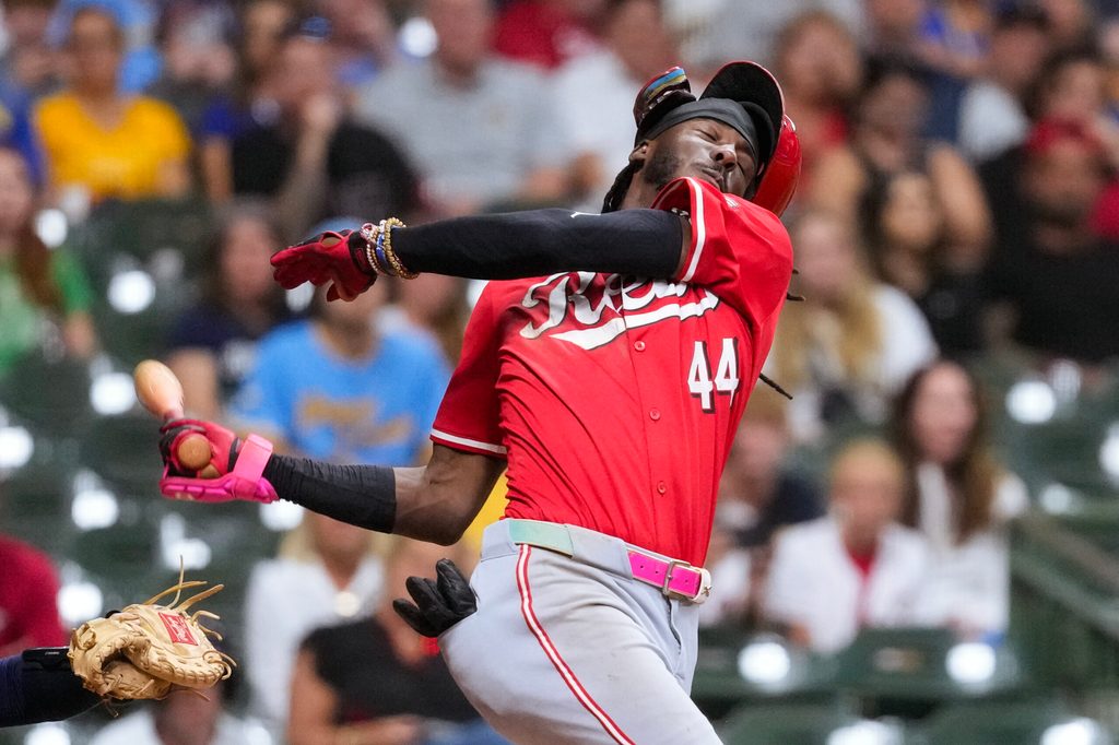 Sep 27, 2025; Milwaukee, Wisconsin, USA;  Cincinnati Reds shortstop Elly De La Cruz (44) loses his helmet while striking out during the ninth inning against the Milwaukee Brewers at American Family Field. Mandatory Credit: Jeff Hanisch-Imagn Images