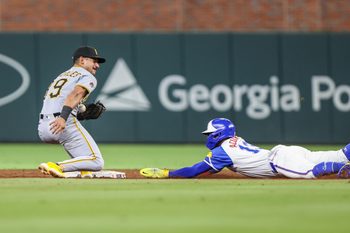 Sep 27, 2025; Cumberland, Georgia, USA; Atlanta Braves outfielder Ronald Acuna Jr. (13) steals second base against Pittsburgh Pirates shortstop Jared Triolo (19) during the ninth inning at Truist Park. Mandatory Credit: Jordan Godfree-Imagn Images