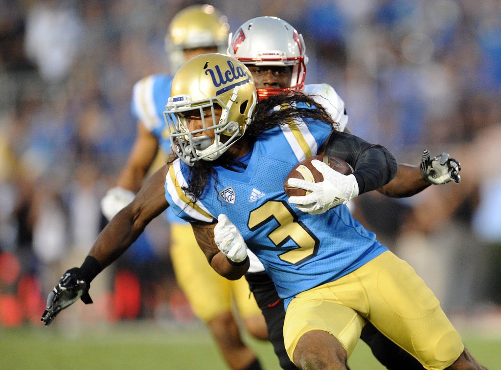 September 10, 2016; Pasadena, CA, USA; UCLA Bruins defensive back Randall Goforth (3) carries the ball after intercepting a pass against the UNLV Rebels during the second half at Rose Bowl. Mandatory Credit: Gary A. Vasquez-Imagn Images