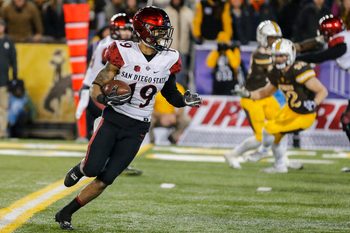 Dec 3, 2016; Laramie, WY, USA; San Diego State Aztecs running back Donnel Pumphrey (19) runs against the Wyoming Cowboys during the fourth quarter at the Mountain West Championship college football game at War Memorial Stadium. The Aztecs beat the Cowboys 27-24. Mandatory Credit: Troy Babbitt-Imagn Images