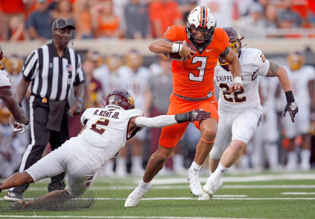 Oklahoma State's Spencer Sanders (3) get by Central Michigan's Ronald Kent Jr. (2) on his way to a touchdown in first quarter during the college football game between the Oklahoma State Cowboys and Central Michigan Chippewa at Boone Pickens Stadium in Stillwater, Oka., Thursday, Sept., 1, 2022. OSU won 58-44.
Osu Vs Central Michigan
