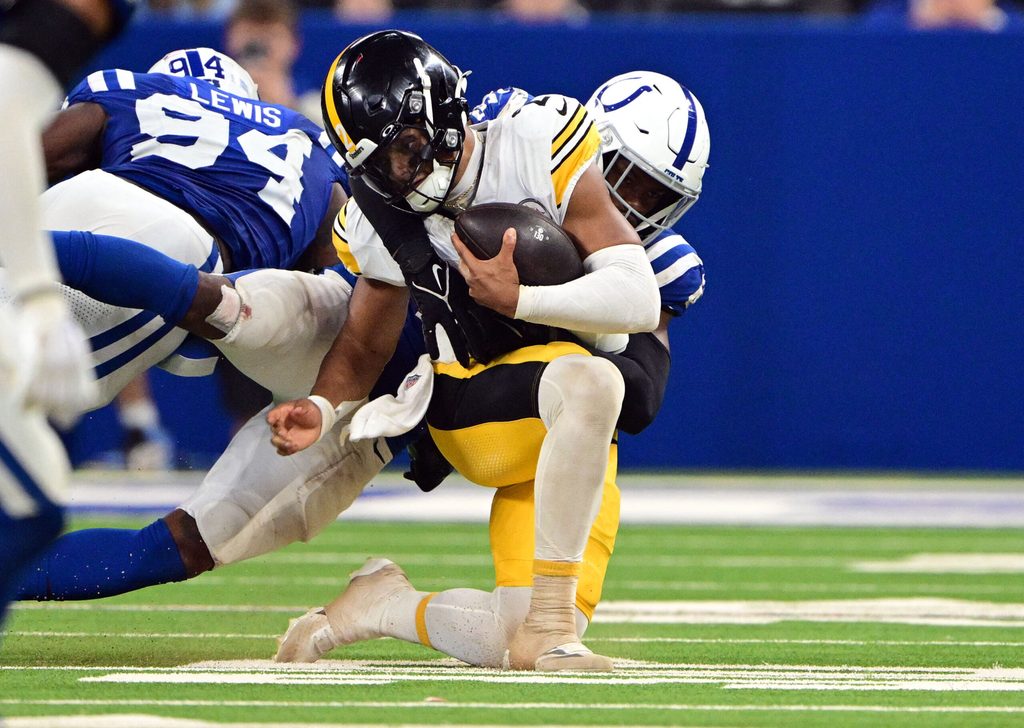 Sep 29, 2024; Indianapolis, Indiana, USA; Indianapolis Colts defensive end Tyquan Lewis (94) and linebacker E.J. Speed (45) sack Pittsburgh Steelers quarterback Justin Fields (2) during the second half at Lucas Oil Stadium. Mandatory Credit: Marc Lebryk-Imagn Images