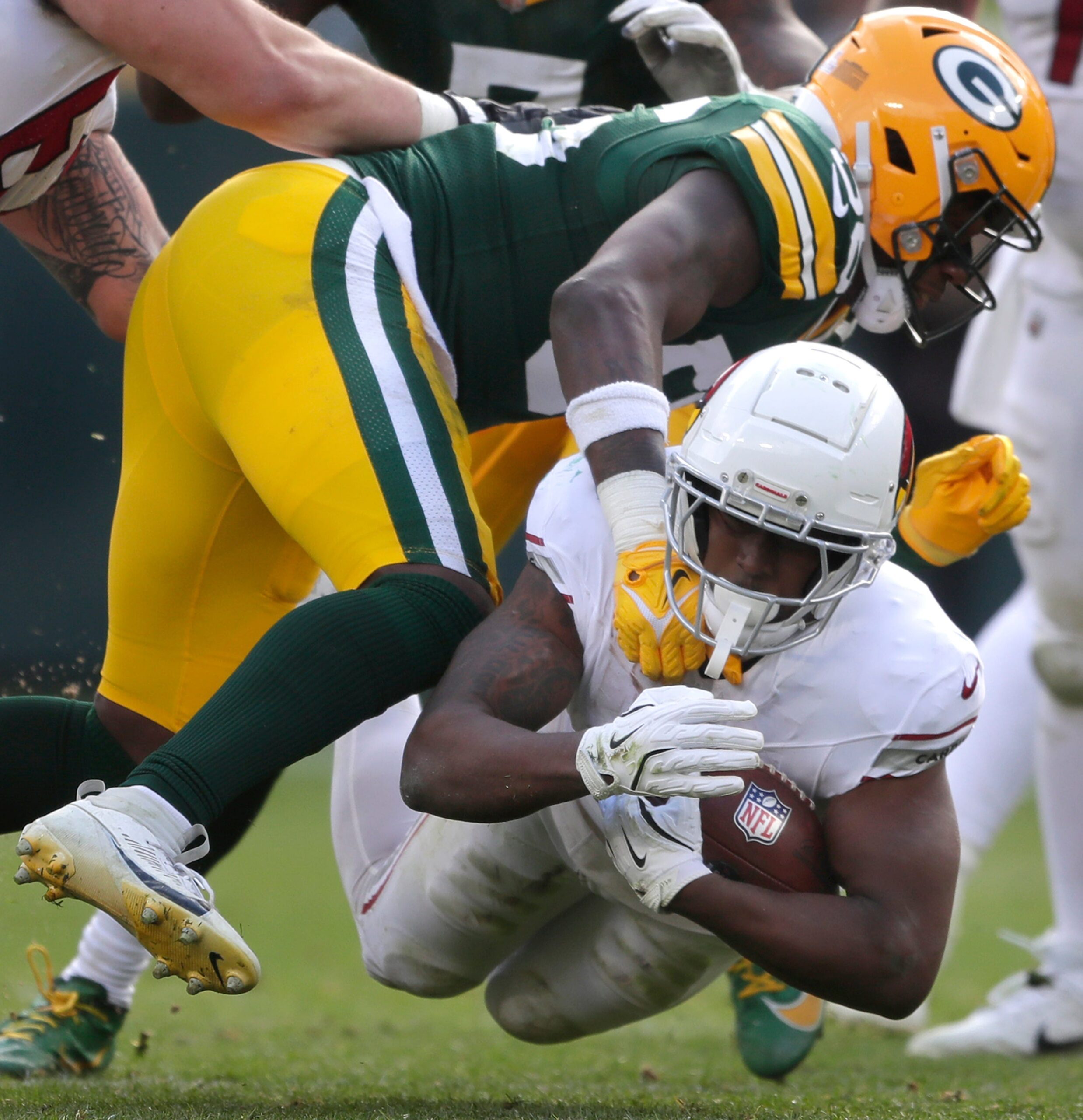 Green Bay Packers linebacker Edgerrin Cooper (56) tackles Arizona Cardinals running back Emari Demercado (31) on Sunday, October 13, 2024 at Lambeau Field in Green Bay, Wis. The Packers defeated the Cardinals 34-13.
Wm. Glasheen USA TODAY NETWORK-Wisconsin