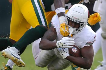 Green Bay Packers linebacker Edgerrin Cooper (56) tackles Arizona Cardinals running back Emari Demercado (31) on Sunday, October 13, 2024 at Lambeau Field in Green Bay, Wis. The Packers defeated the Cardinals 34-13.
Wm. Glasheen USA TODAY NETWORK-Wisconsin